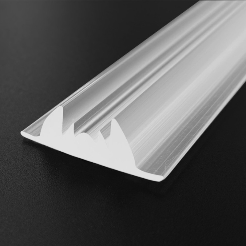 Close-up detail of Baiwei L520 extruded linear lens profile showing optical surface texture