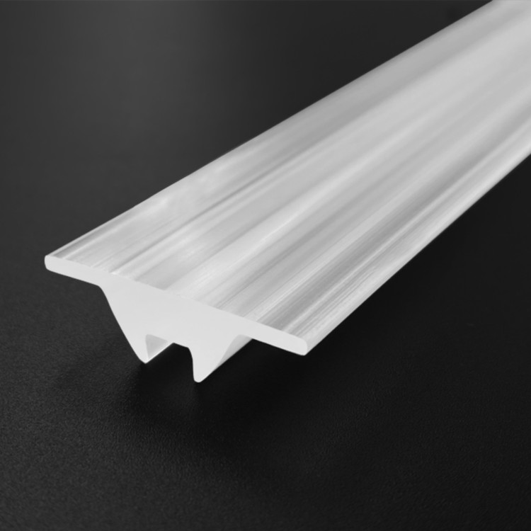Close-up detail of Baiwei L521 extruded linear lens profile showing optical surface texture